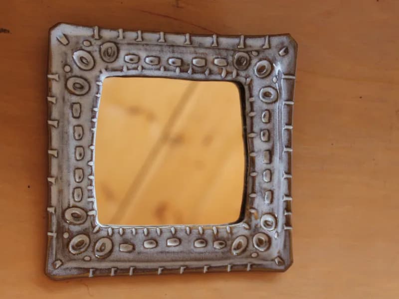 Ceramic Mirror Hanging on Wall