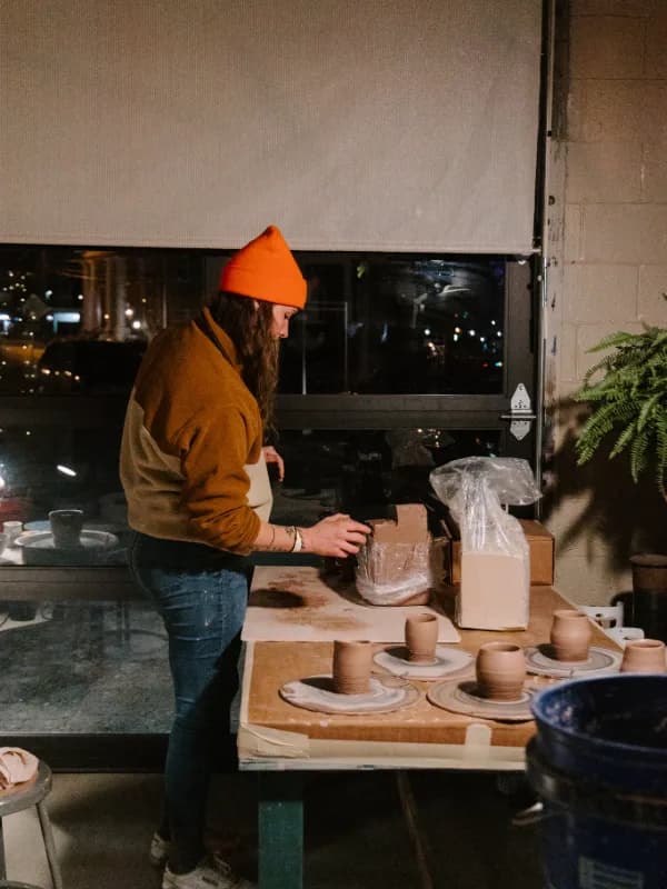 Beginner Potter making pots in the Made on Elk Studio